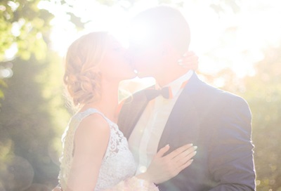 foreign bride and groom kissing